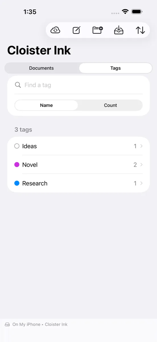 The Tags tab in the sidebar on iPhone: Ideas, Novel, and Research, each with a color dot and a document count.